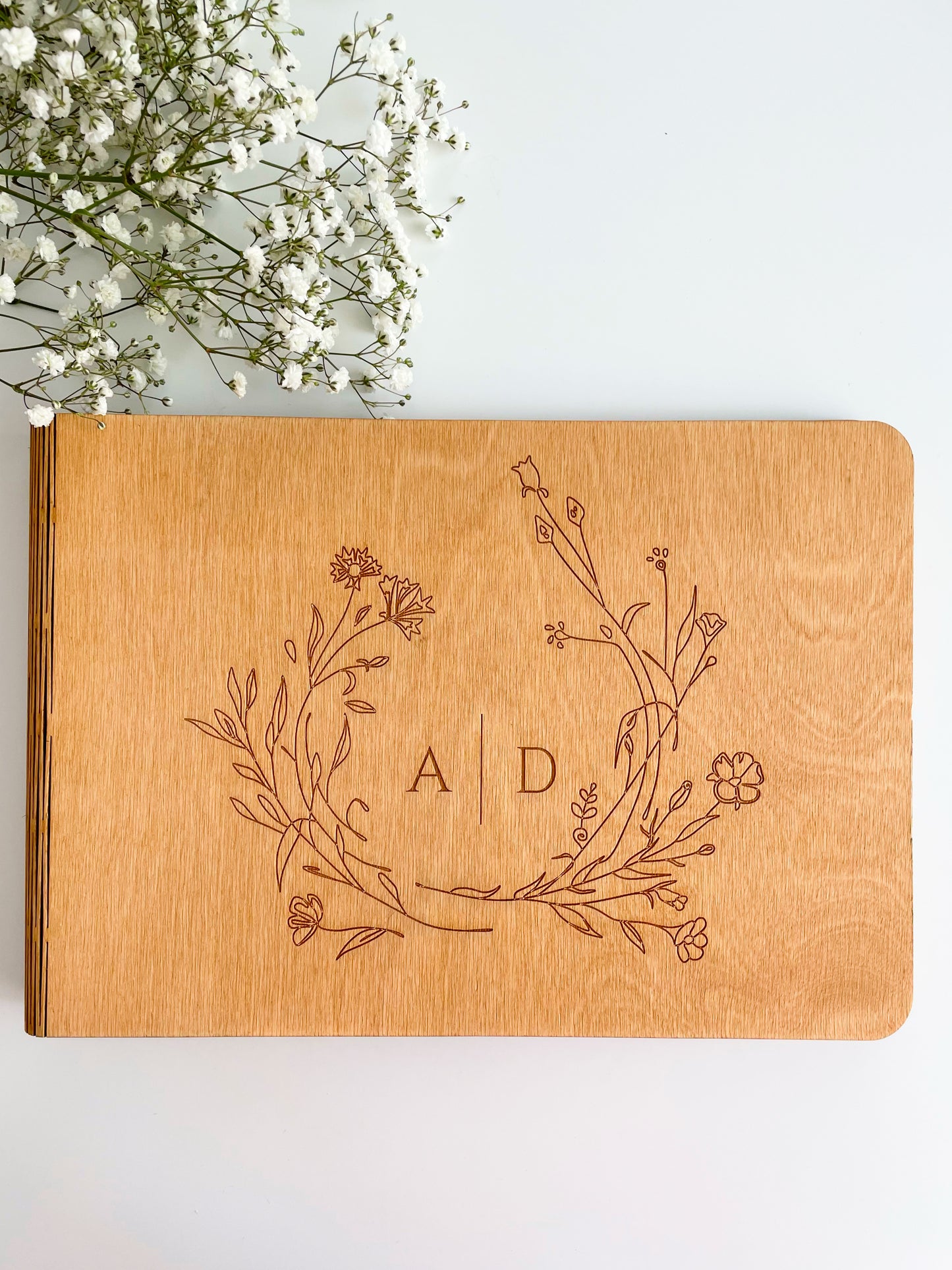 Engraved wooden wedding photo album with rustic design