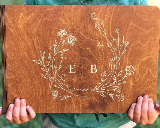 Personalized wooden photo album with engraved names on cover