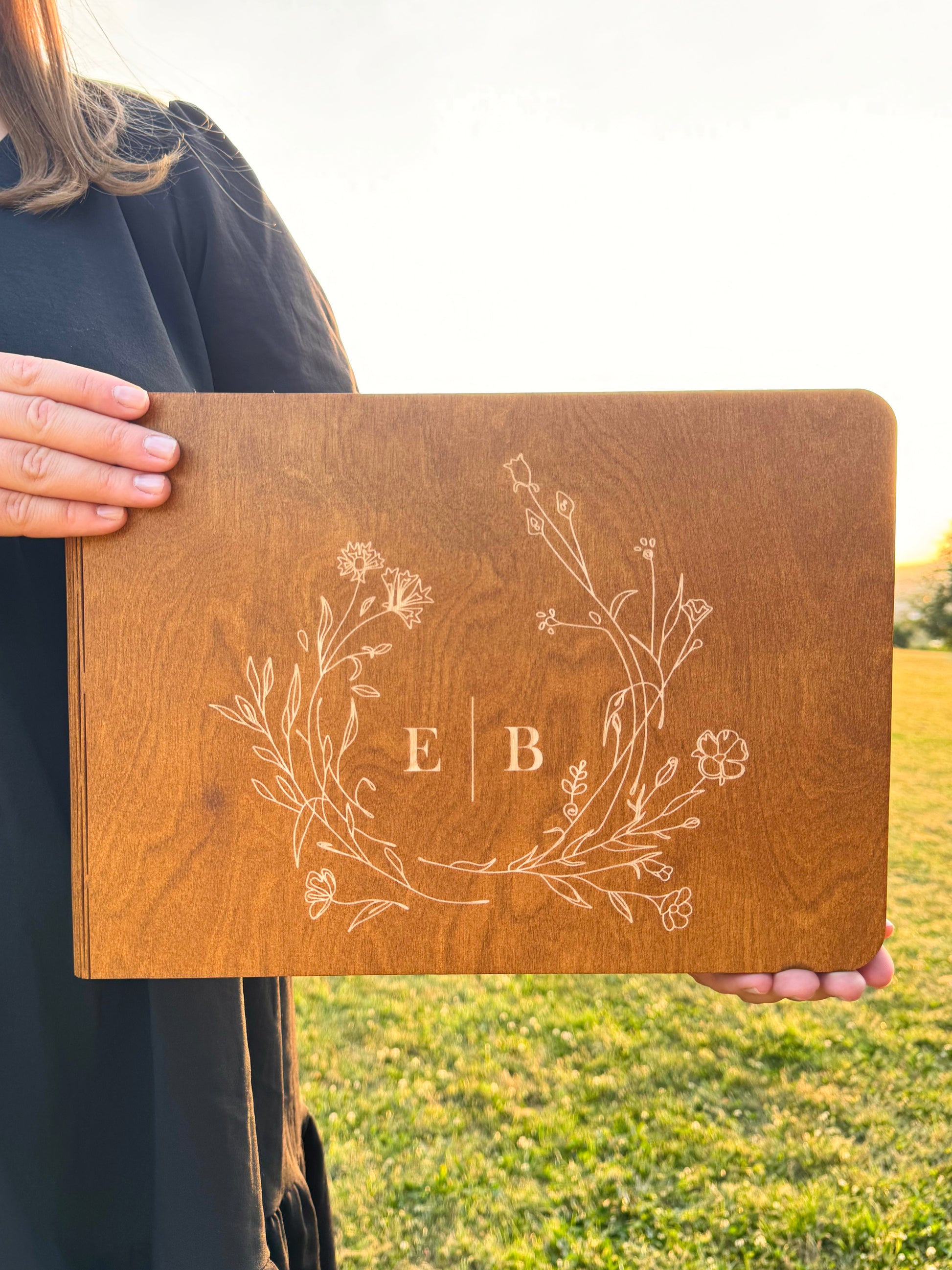 Rustic wedding guest book made of engraved wood