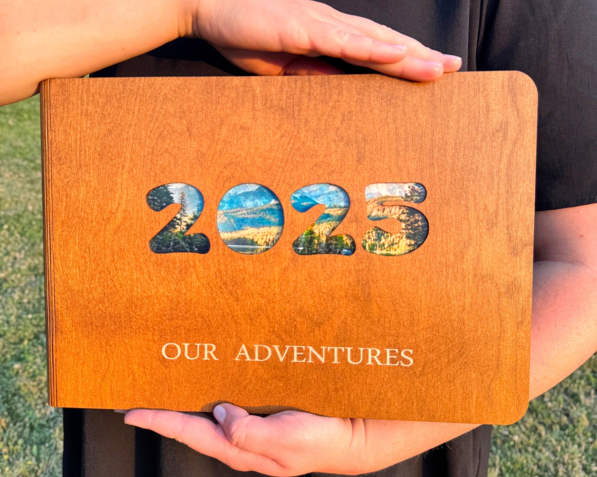 Personalized wooden photo album with engraved names on cover